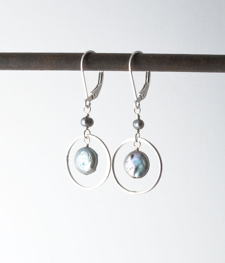 Freshwater pearl, sterling silver. 

Earrings, 1.5" 